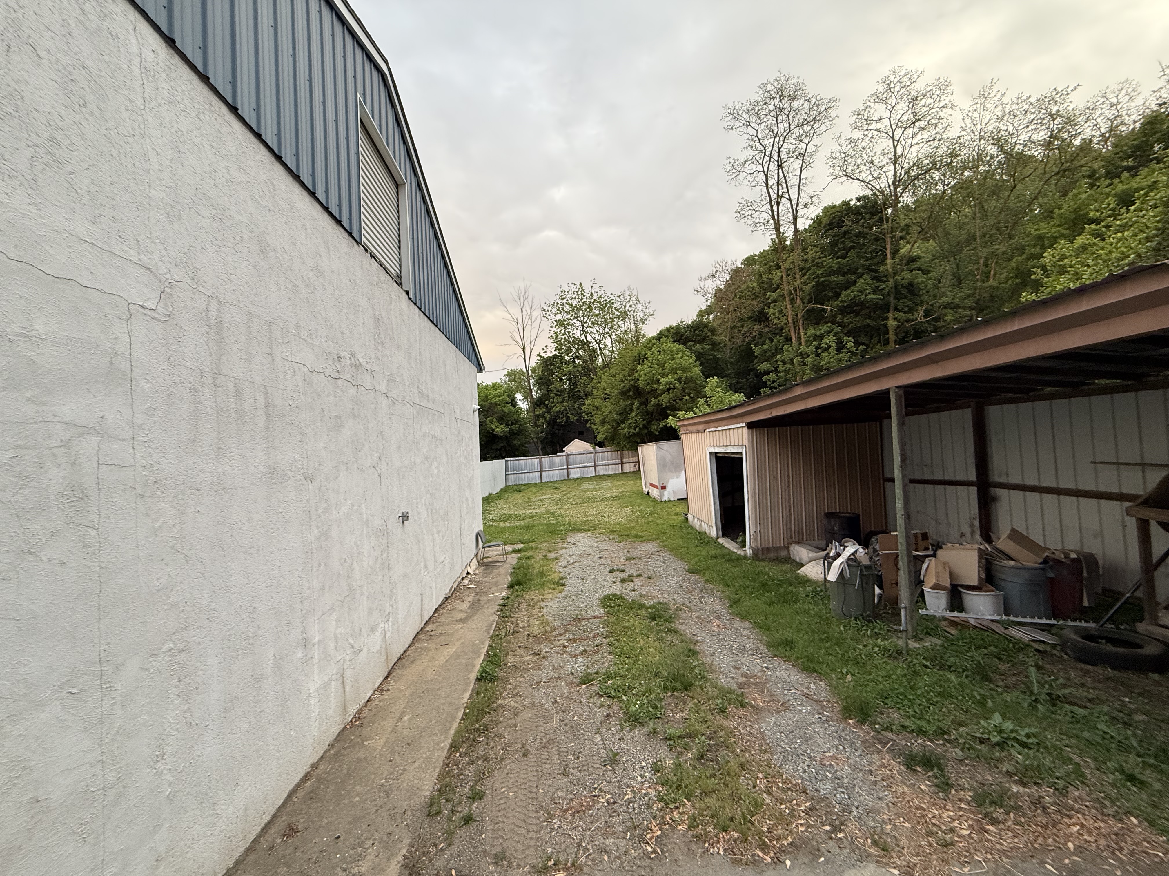Back of property with storage area and additional space